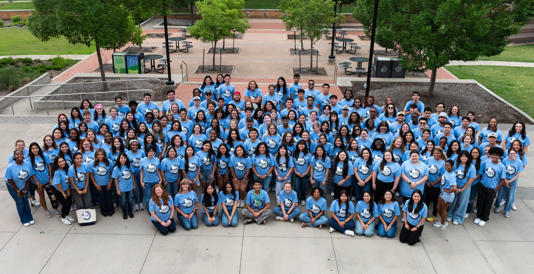 Group photo of everyone outside in the shirts