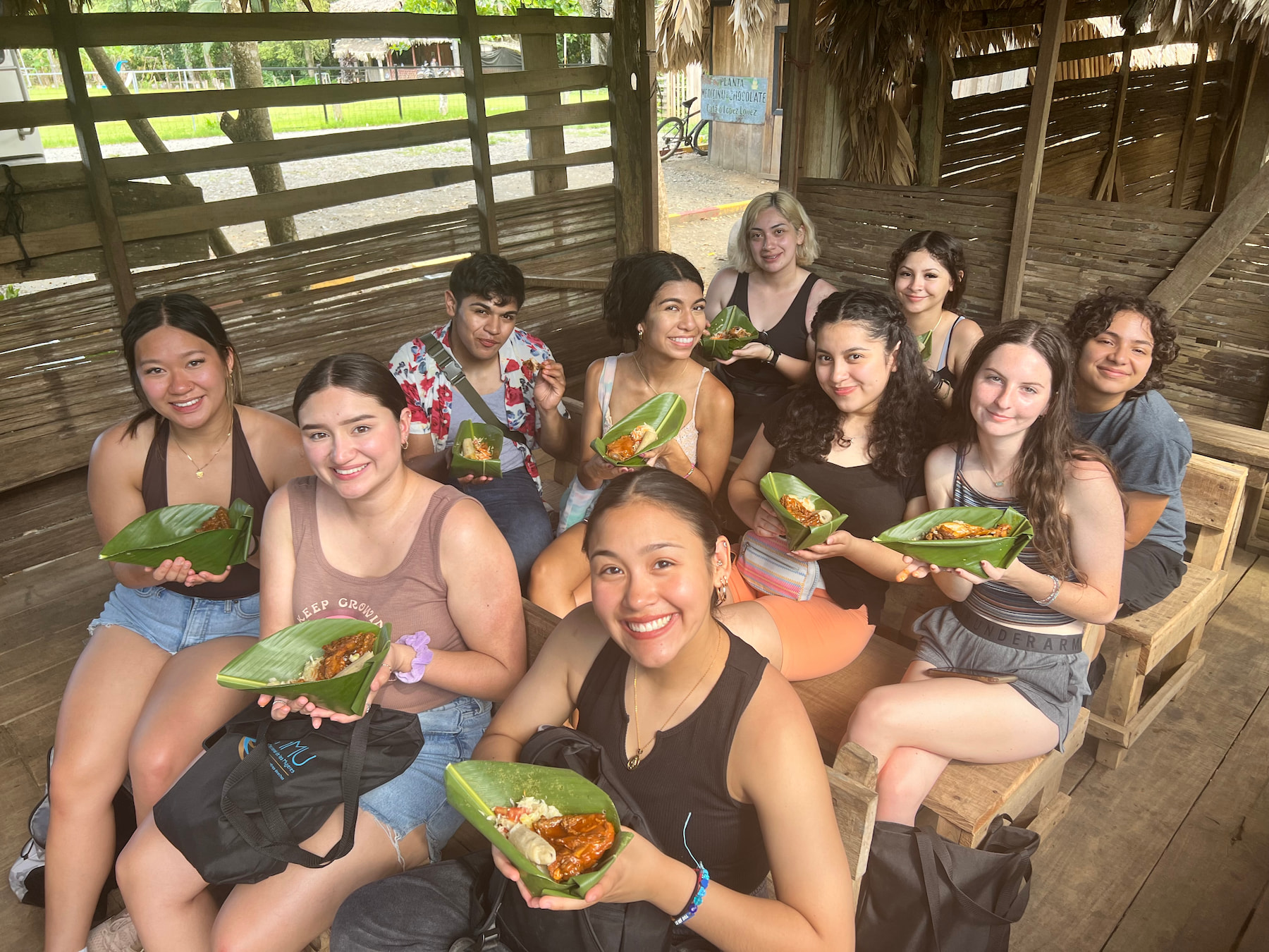 Group photo of students and their food in another country