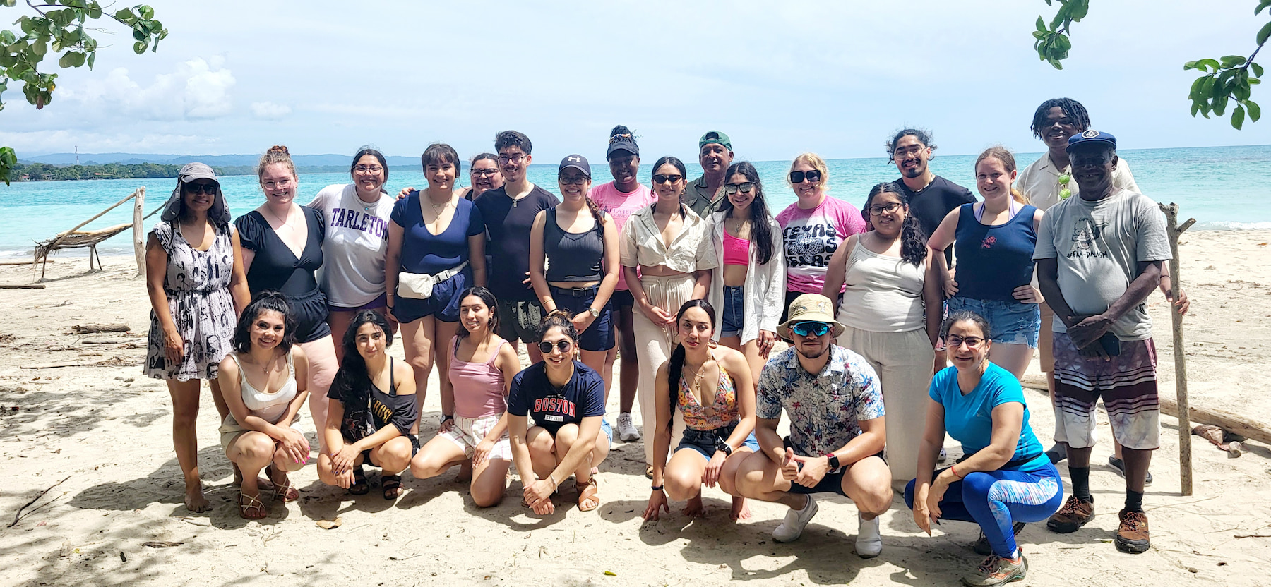 Group photo of students at the beach