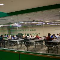 People sitting at desks in rows