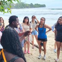 Group talking with a person on the beach