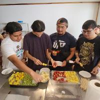 group of 5 students getting food